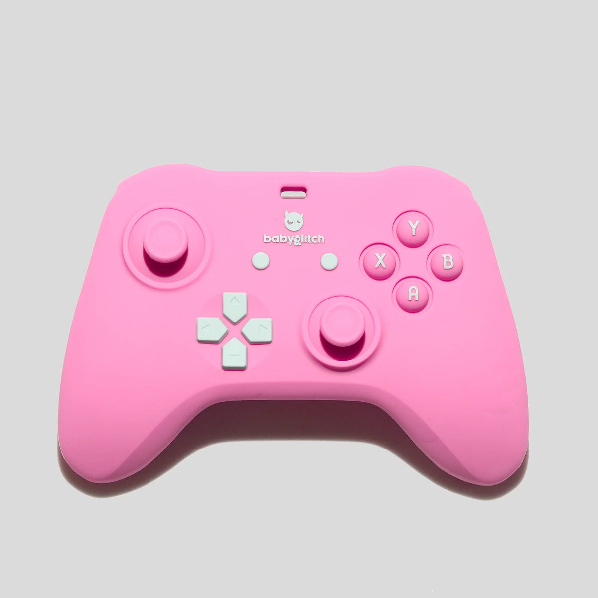 Baby Teether in Pink Silicone with a Game Controller Shape and Easy-Grip Handles for Little Hands