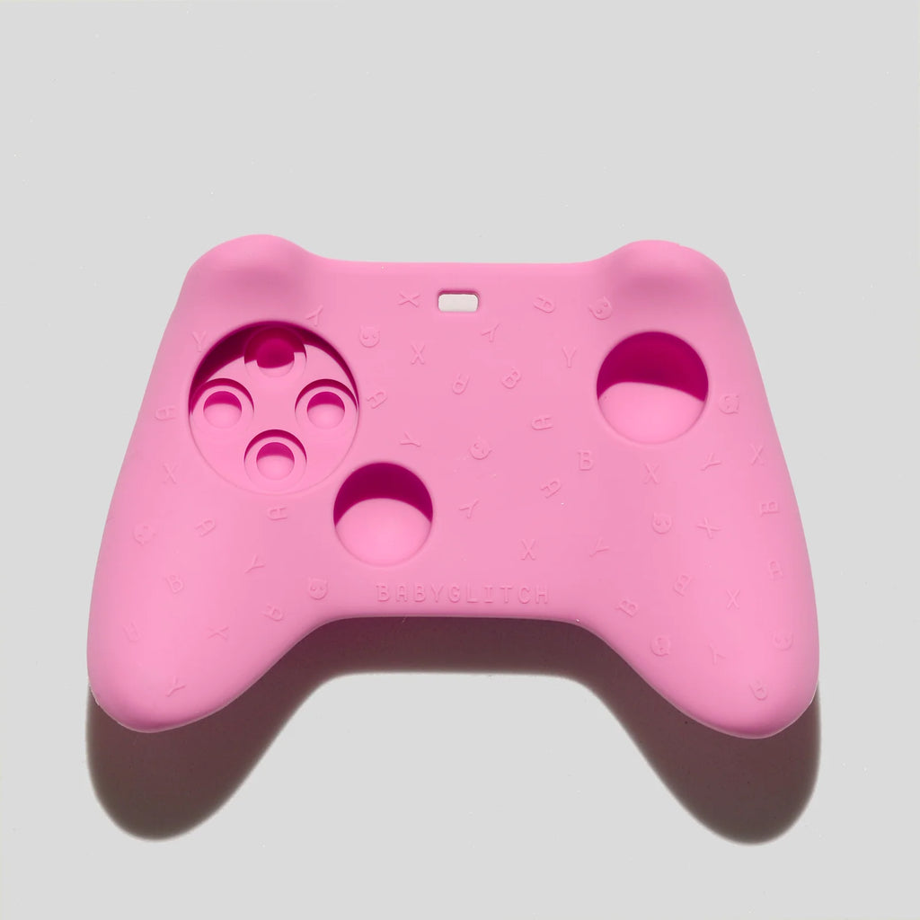 Baby Teether in Pink Silicone with a Game Controller Shape and Easy-Grip Handles for Little Hands
