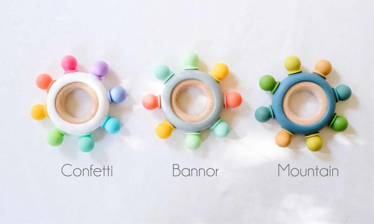 Baby Teether with Eight Silicone Nubs and Beech Wood Ring, Freezer Friendly in Five Color Designs