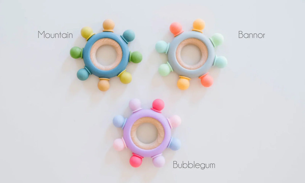 Baby Teether with Eight Silicone Nubs and Beech Wood Ring, Freezer Friendly in Five Color Designs