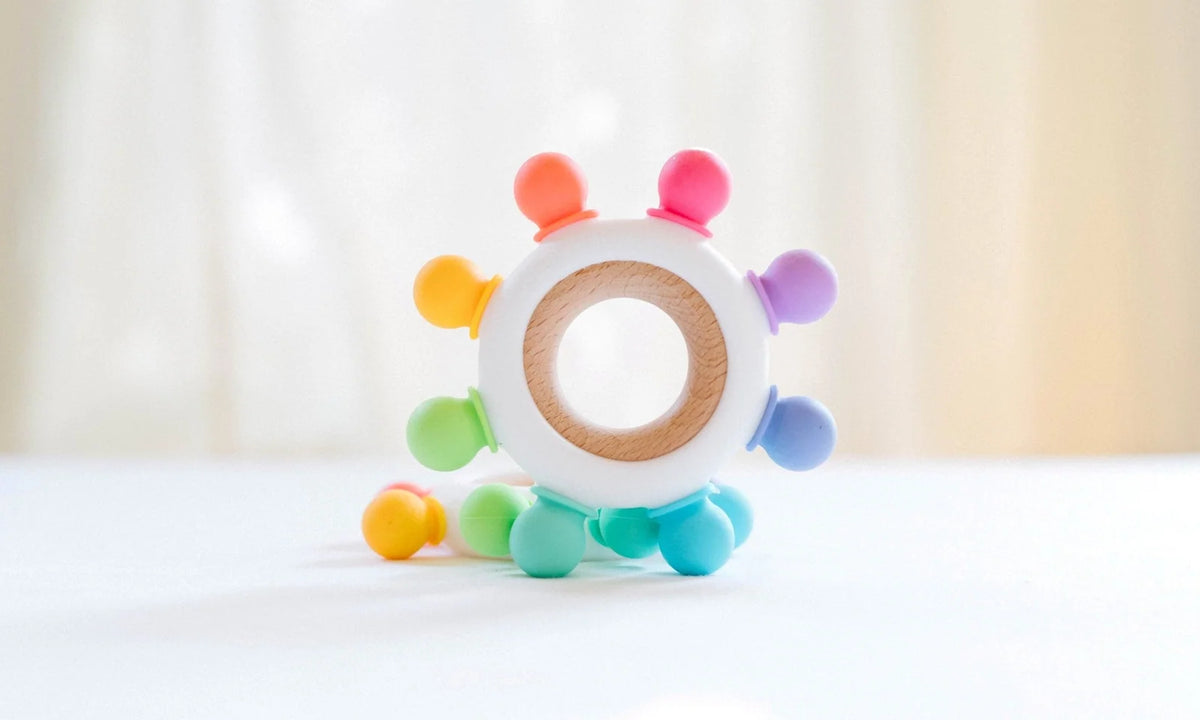 Baby Teether with Eight Silicone Nubs and Beech Wood Ring, Freezer Friendly in Five Color Designs — Confetti