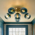 Blue Glass Bubble Semi Flush Chandelier with Gradient Globes and a Curved Brushed Brass Sputnik Frame — 6-Lt
