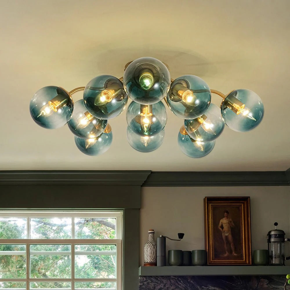 Blue Glass Bubble Semi Flush Chandelier with Gradient Globes and a Curved Brushed Brass Sputnik Frame
