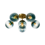 Blue Glass Bubble Semi Flush Chandelier with Gradient Globes and a Curved Brushed Brass Sputnik Frame