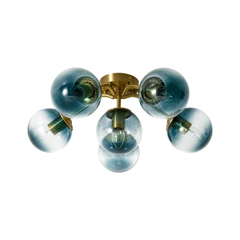 Blue Glass Bubble Semi Flush Chandelier with Gradient Globes and a Curved Brushed Brass Sputnik Frame