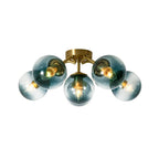 Blue Glass Bubble Semi Flush Chandelier with Gradient Globes and a Curved Brushed Brass Sputnik Frame