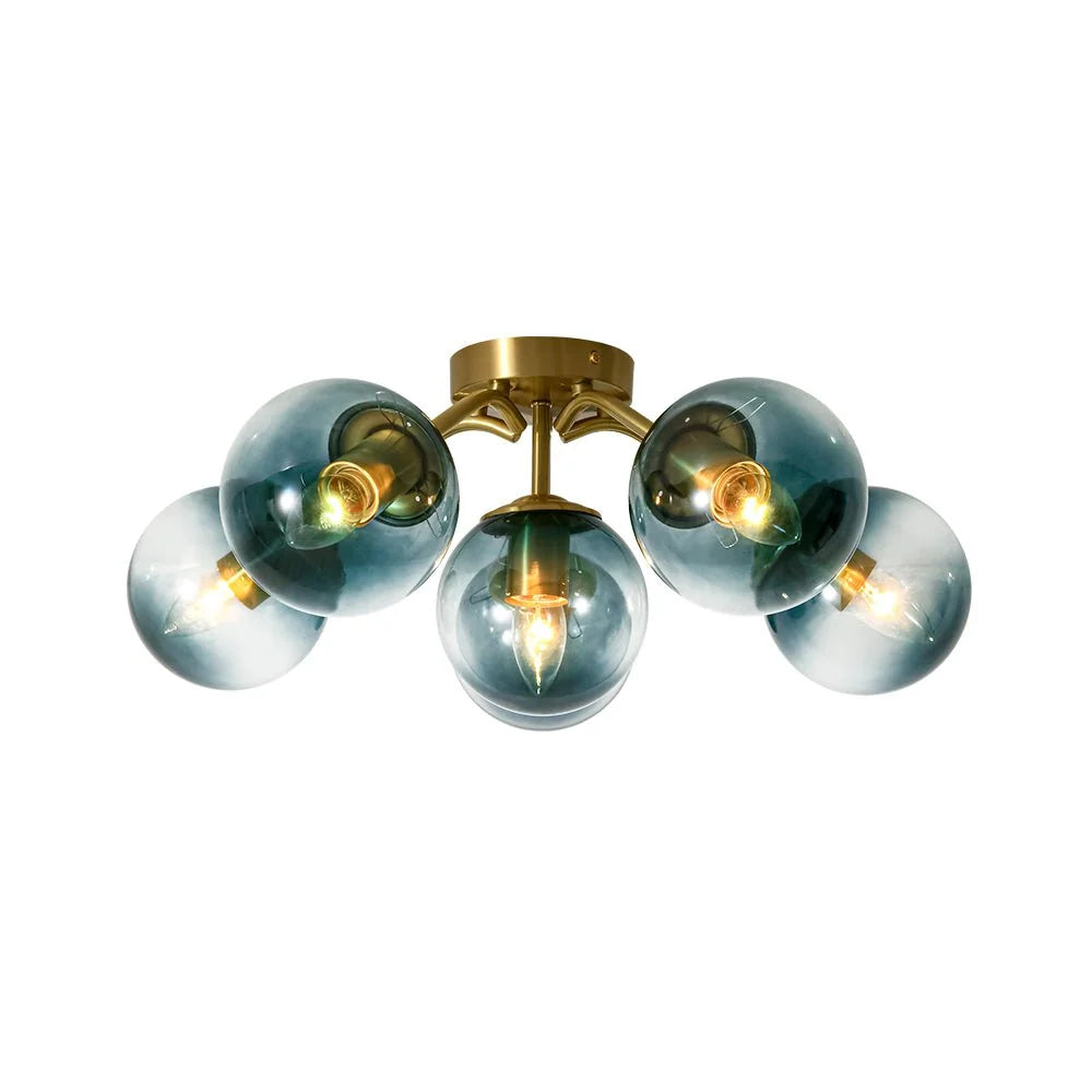 Blue Glass Bubble Semi Flush Chandelier with Gradient Globes and a Curved Brushed Brass Sputnik Frame