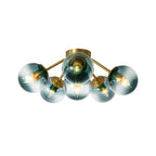 Blue Glass Bubble Semi Flush Chandelier with Gradient Globes and a Curved Brushed Brass Sputnik Frame
