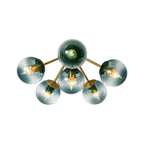 Blue Glass Bubble Semi Flush Chandelier with Gradient Globes and a Curved Brushed Brass Sputnik Frame