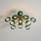 Blue Glass Bubble Semi Flush Chandelier with Gradient Globes and a Curved Brushed Brass Sputnik Frame