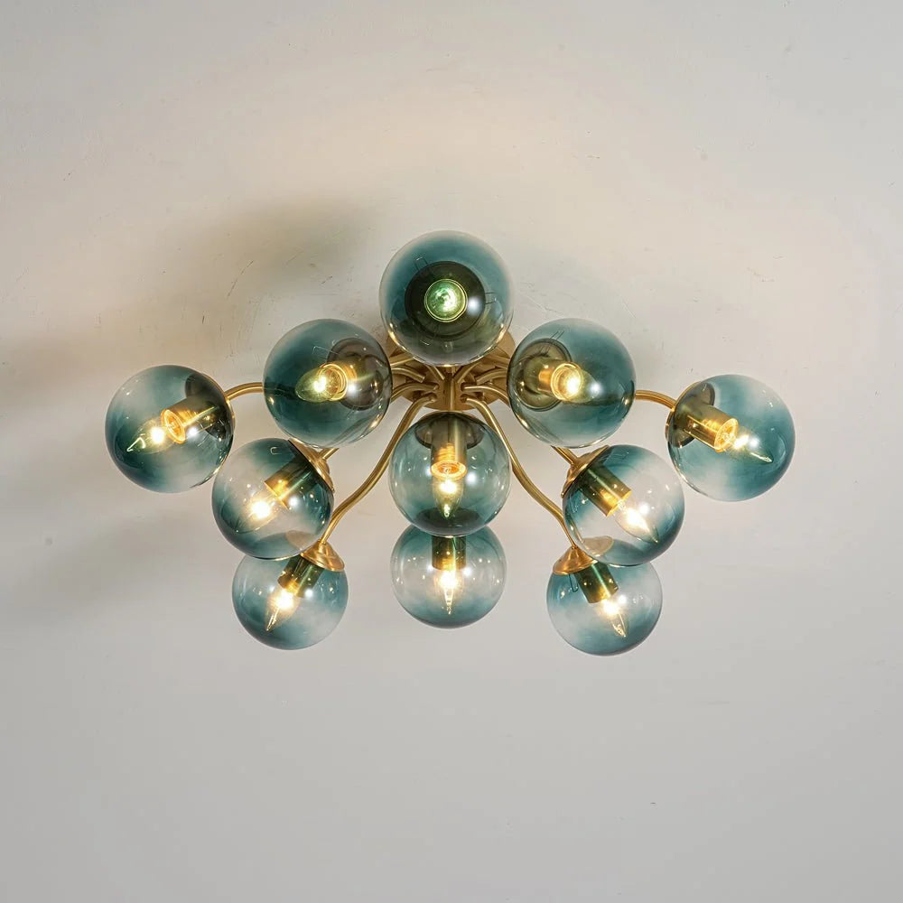 Blue Glass Bubble Semi Flush Chandelier with Gradient Globes and a Curved Brushed Brass Sputnik Frame