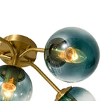 Blue Glass Bubble Semi Flush Chandelier with Gradient Globes and a Curved Brushed Brass Sputnik Frame