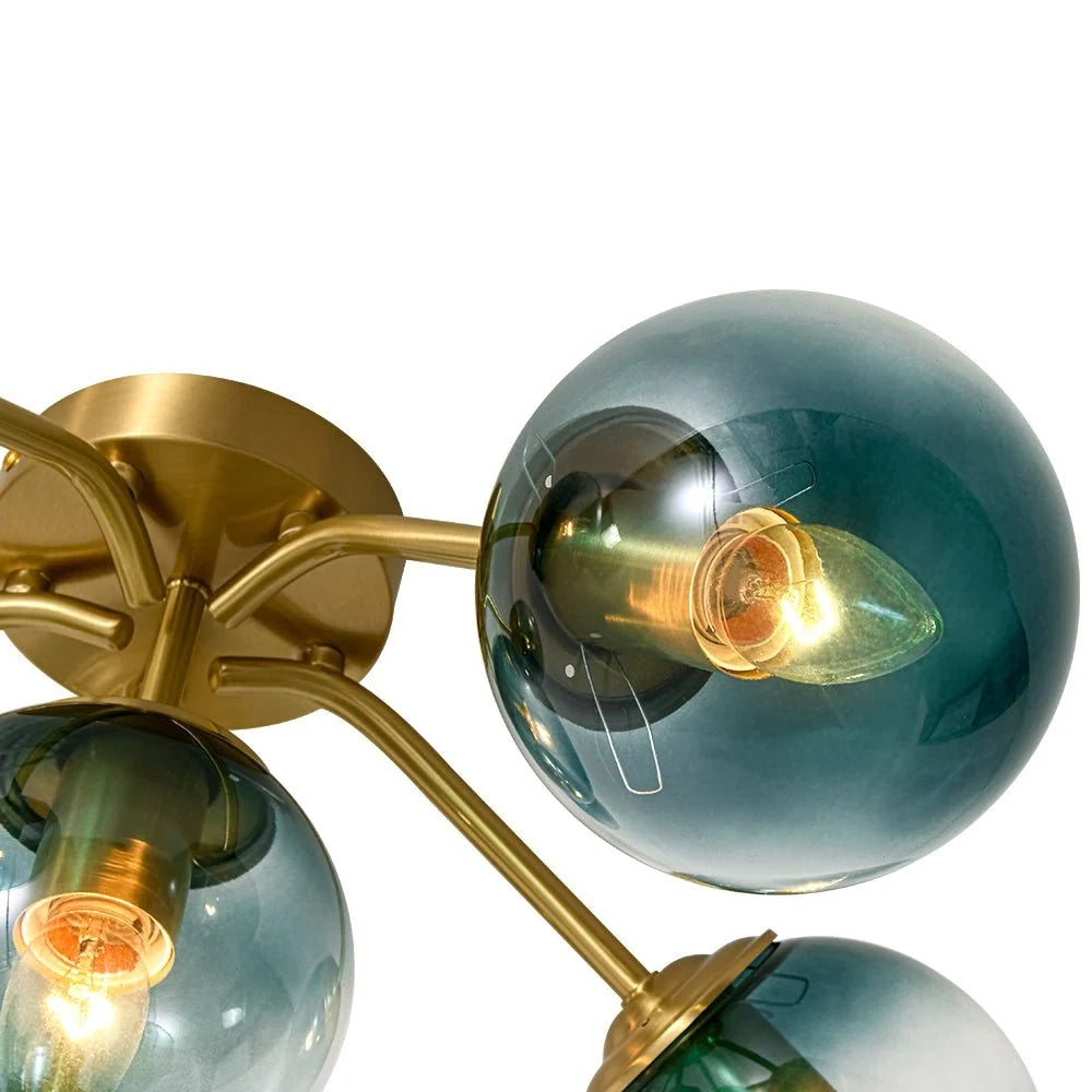 Blue Glass Bubble Semi Flush Chandelier with Gradient Globes and a Curved Brushed Brass Sputnik Frame