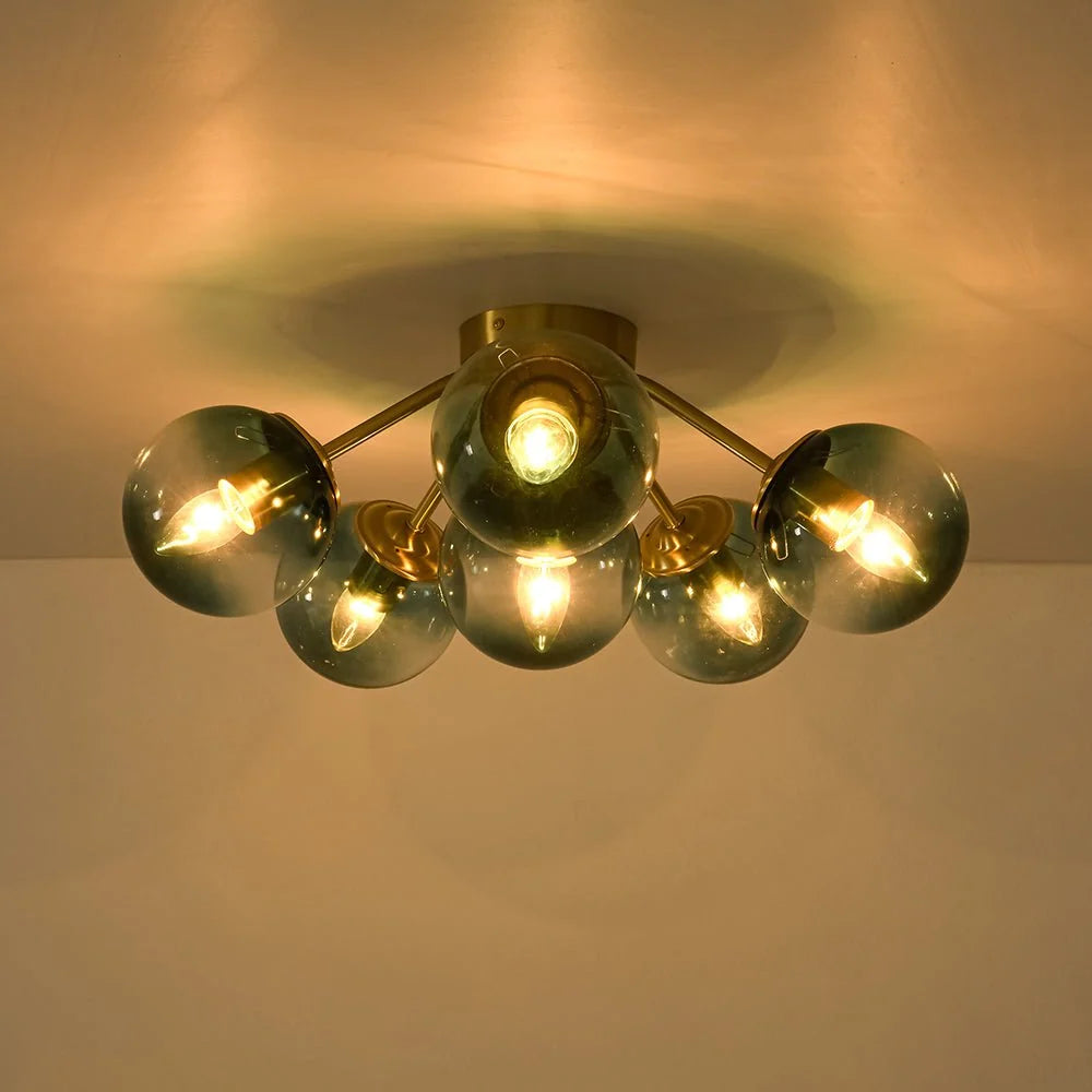 Blue Glass Bubble Semi Flush Chandelier with Gradient Globes and a Curved Brushed Brass Sputnik Frame