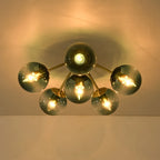Blue Glass Bubble Semi Flush Chandelier with Gradient Globes and a Curved Brushed Brass Sputnik Frame