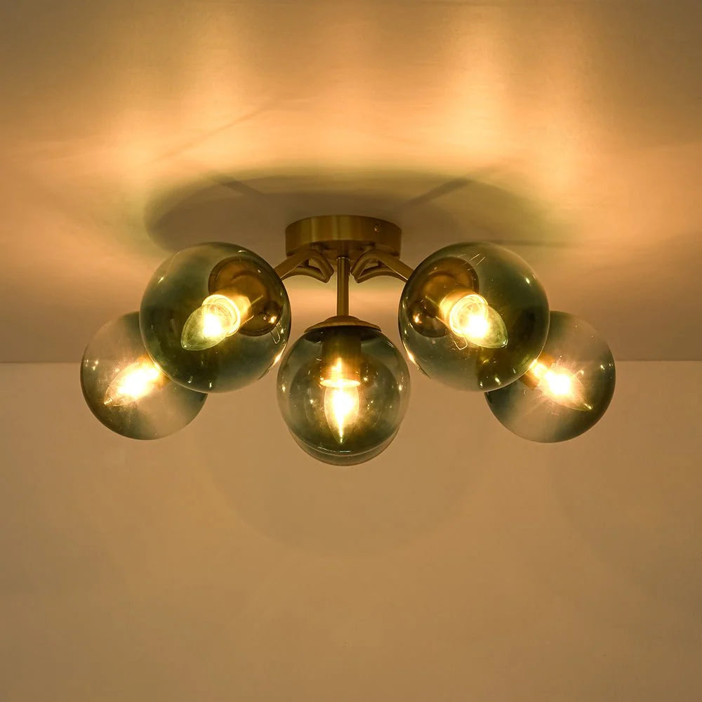Blue Glass Bubble Semi Flush Chandelier with Gradient Globes and a Curved Brushed Brass Sputnik Frame
