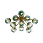 Blue Glass Bubble Semi Flush Chandelier with Gradient Globes and a Curved Brushed Brass Sputnik Frame