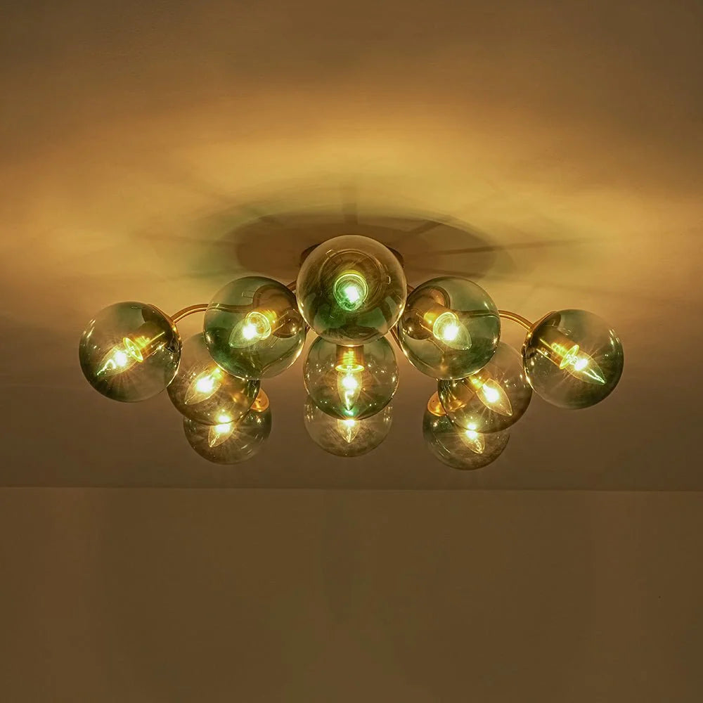 Blue Glass Bubble Semi Flush Chandelier with Gradient Globes and a Curved Brushed Brass Sputnik Frame