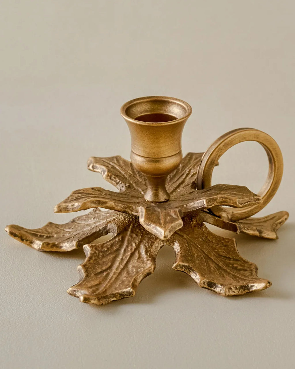Brass Holly Candle Holder with Handle for Festive Mantel and Holiday Living Room Decor · Holly-shaped design