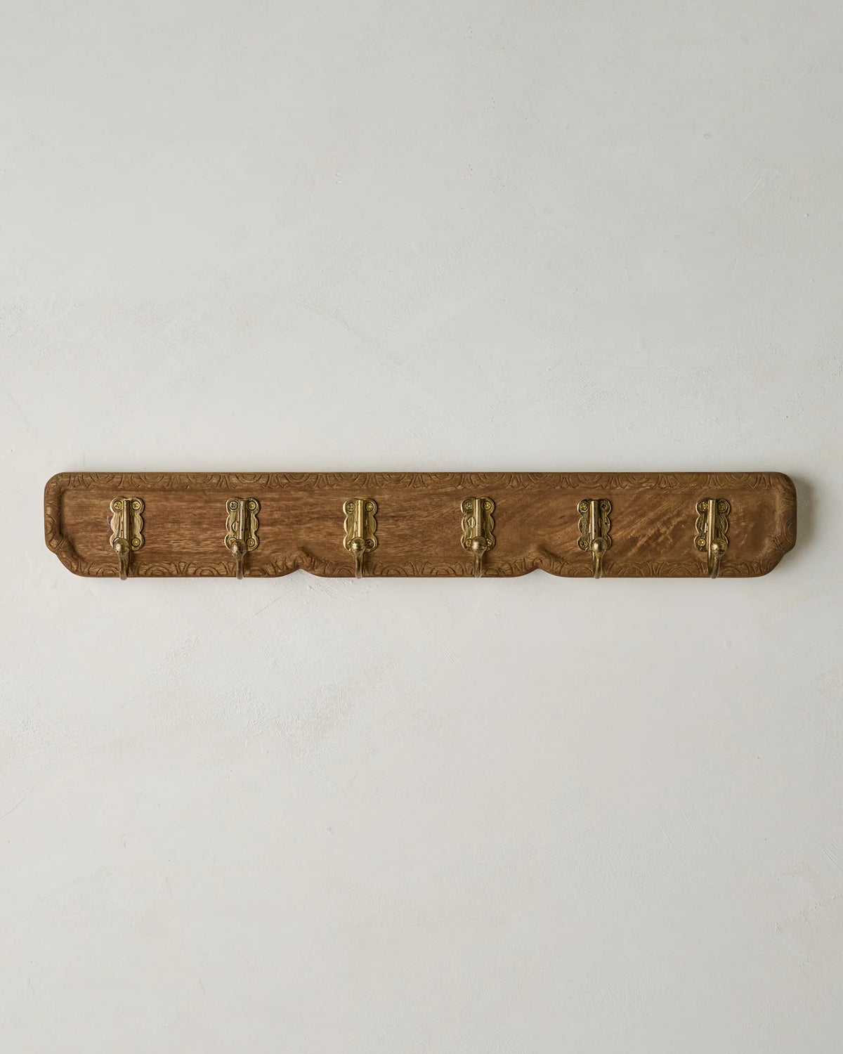 Carved Wood and Brass Hook Rack for Entryway Wall Organization of Coats, Hats, and Bags · Carved wood details