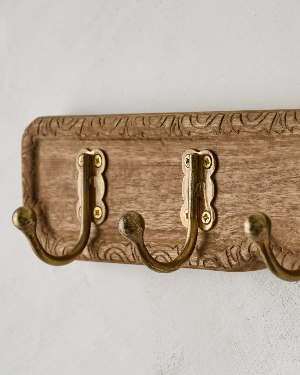 Carved Wood and Brass Hook Rack for Entryway Wall Organization of Coats, Hats, and Bags · Carved wood details