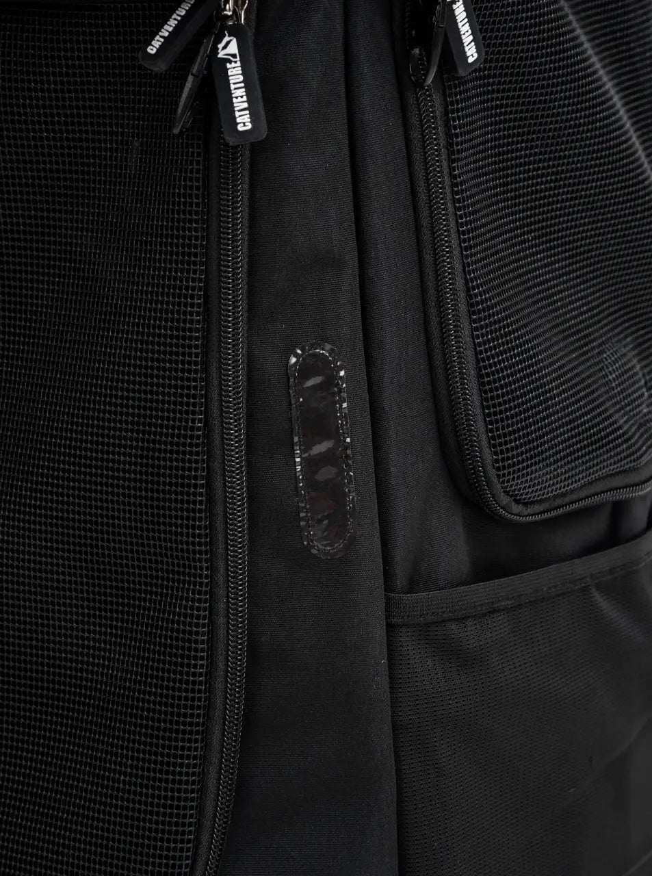 Cat Carrier Backpack with Technical Performance Materials and a Design Centered on Feline Curiosity