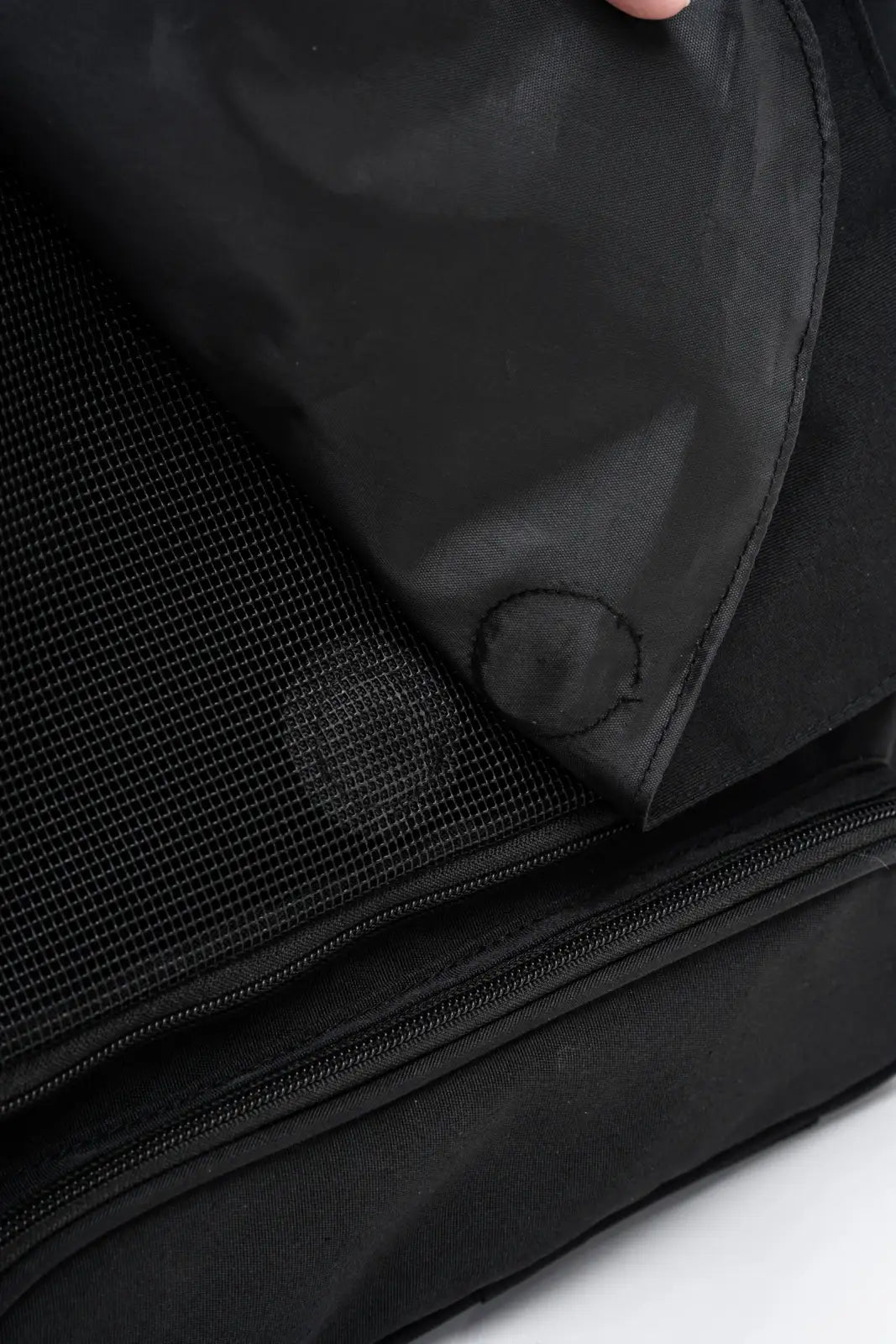 Cat Carrier Backpack with Technical Performance Materials and a Design Centered on Feline Curiosity