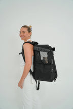 Cat Carrier Backpack with Technical Performance Materials and a Design Centered on Feline Curiosity