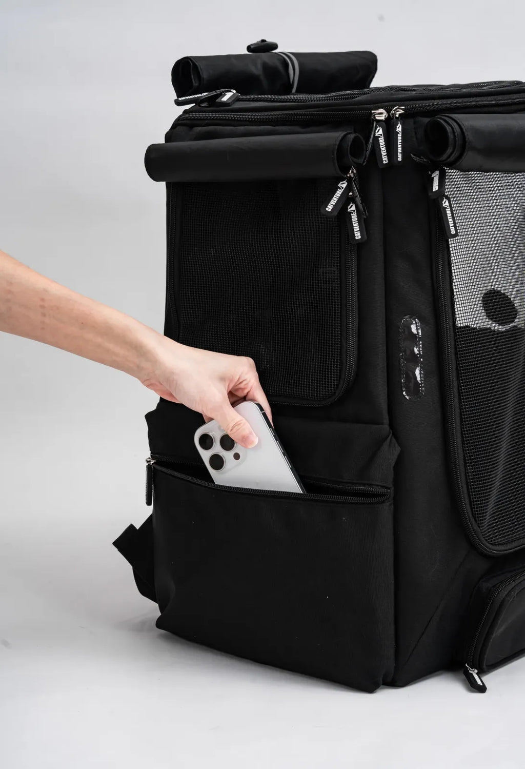 Cat Carrier Backpack with Technical Performance Materials and a Design Centered on Feline Curiosity