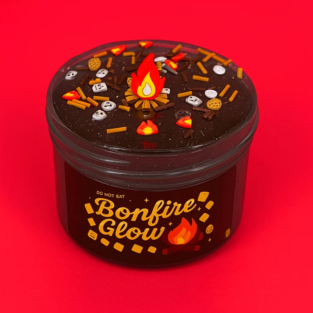 Clear Slime in a 7oz Bonfire Theme with Golden Glitter, Flame Charm and a Light Musk-Mahogany Scent