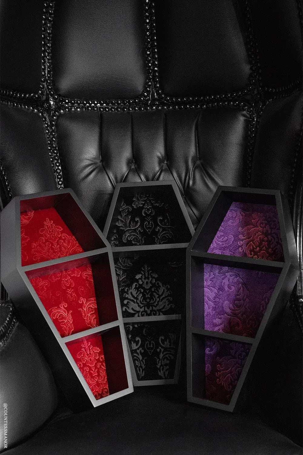 Coffin Wall Shelf with Embossed Velvet Damask Backing and Three Display Tiers in a Matte Black Finish