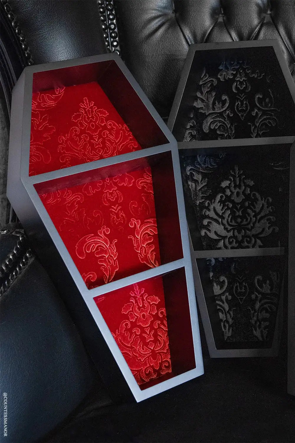 Coffin Wall Shelf with Embossed Velvet Damask Backing and Three Display Tiers in a Matte Black Finish