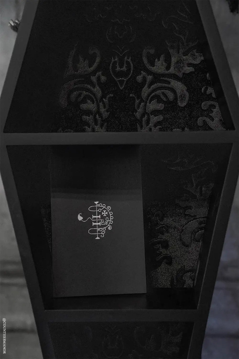 Coffin Wall Shelf with Embossed Velvet Damask Backing and Three Display Tiers in a Matte Black Finish