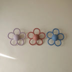 Daisy Rattle Teether with Textured Silicone and Easy-Grasp Handles for Baby Teething and Play