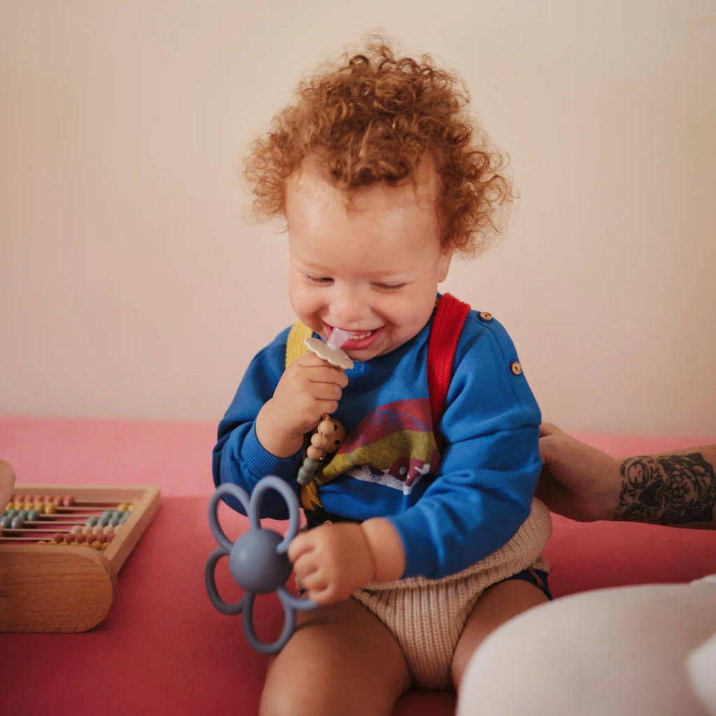 Daisy Rattle Teether with Textured Silicone and Easy-Grasp Handles for Baby Teething and Play