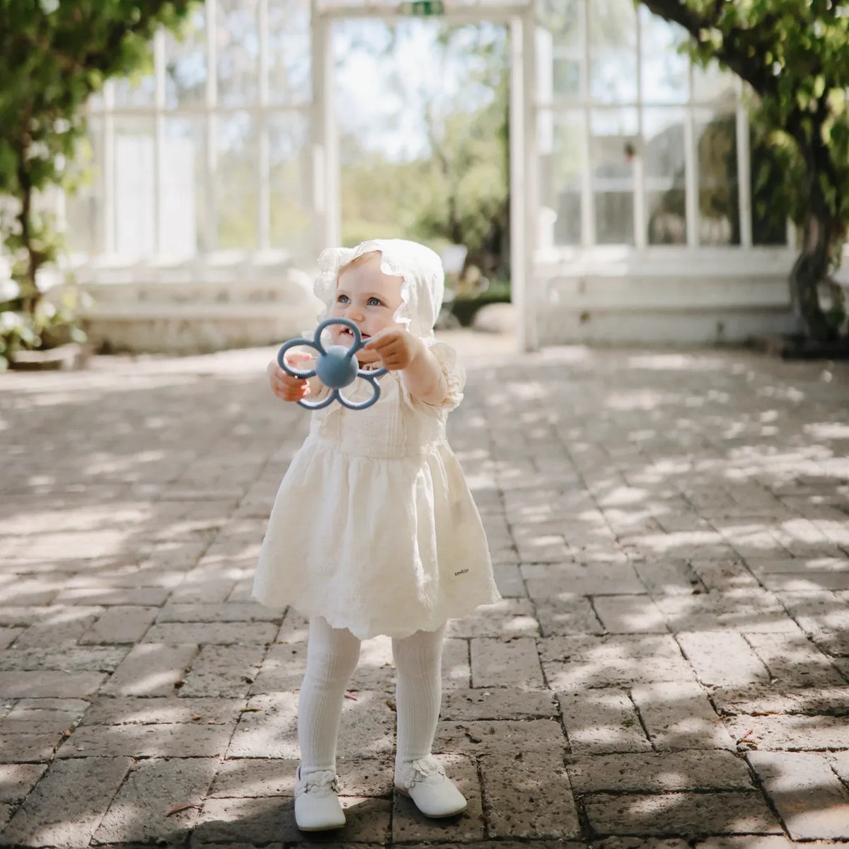 Daisy Rattle Teether with Textured Silicone and Easy-Grasp Handles for Baby Teething and Play