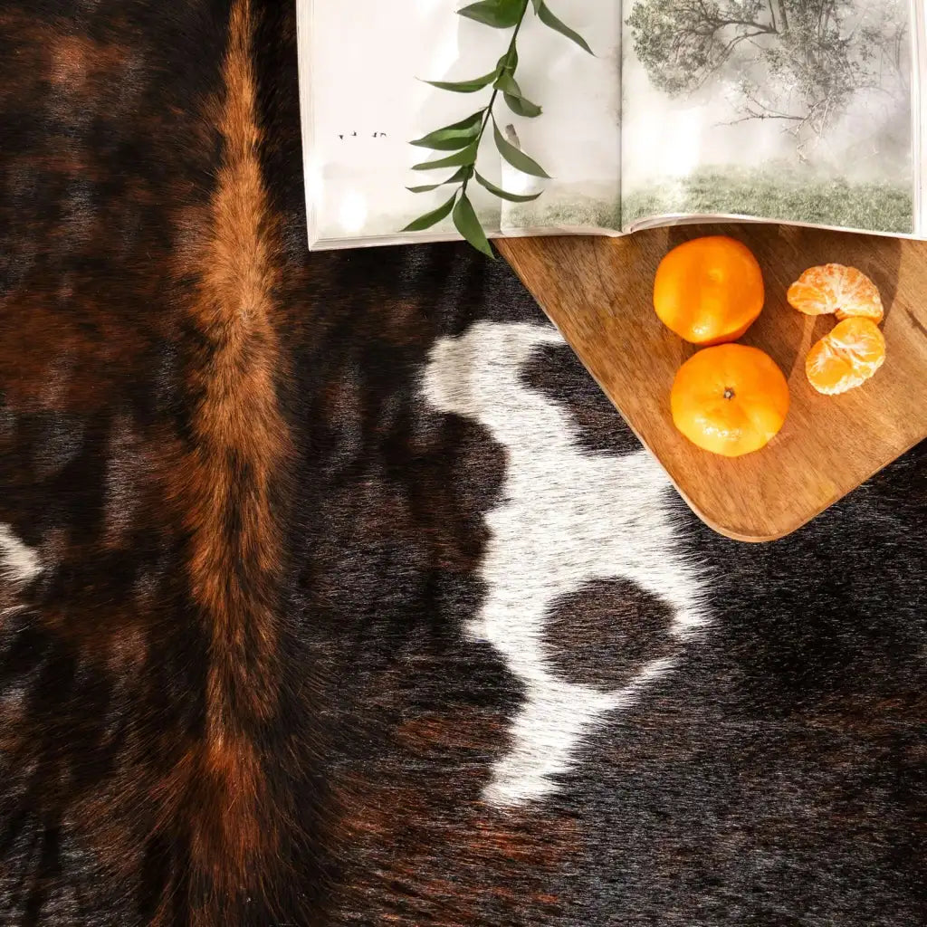 Dark Tricolor Cowhide Rug in Genuine Hair-On Leather, Featuring Deep Brown, Black and Cream Tones