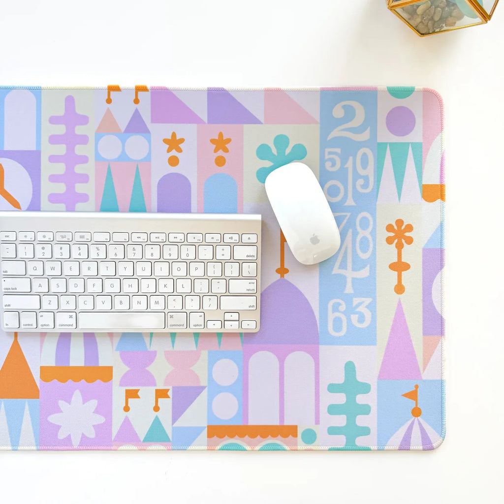 Desk Mat in a Pastel Small World Theme with a Smooth Neoprene Surface and Non-Slip Rubber Backing