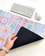 Desk Mat in a Pastel Small World Theme with a Smooth Neoprene Surface and Non-Slip Rubber Backing