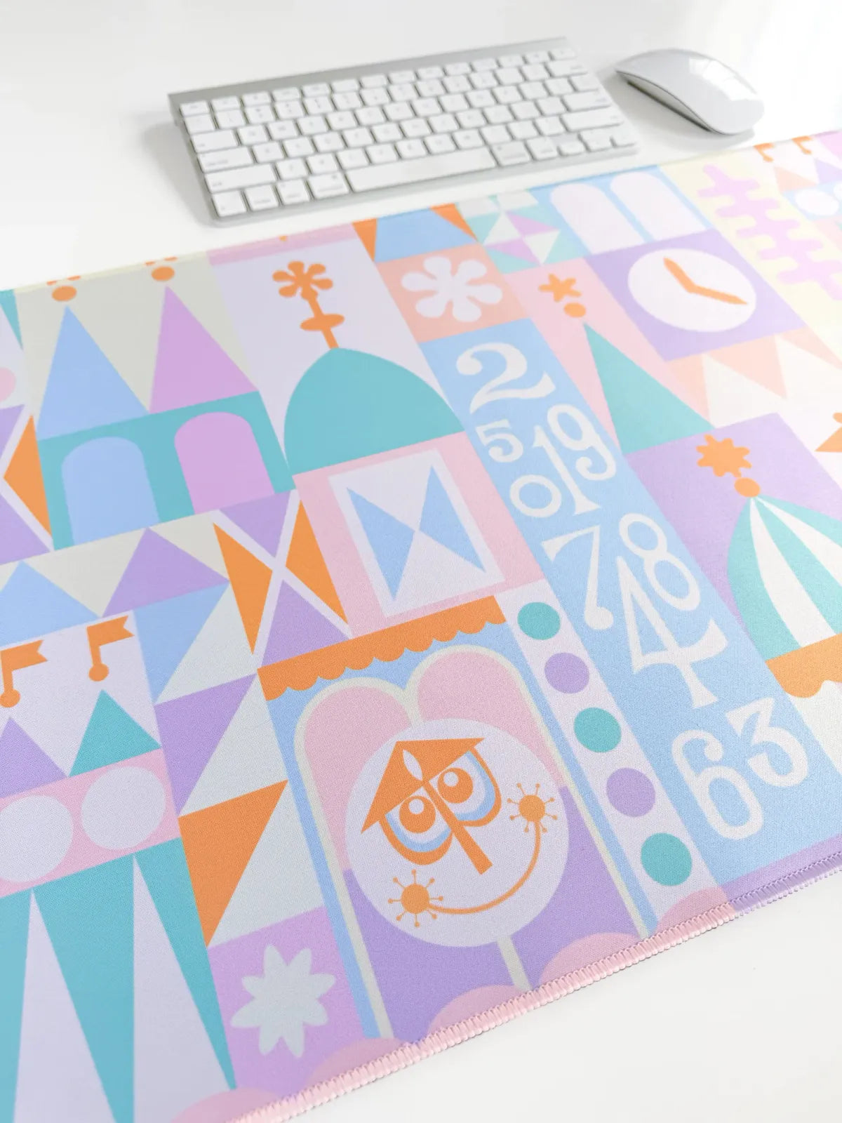 Desk Mat in a Pastel Small World Theme with a Smooth Neoprene Surface and Non-Slip Rubber Backing