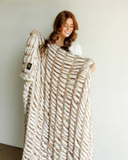 Faux Fur Blanket in Warm Tan with a Subtle Frosted Effect and Stretchy Softness on Both Sides