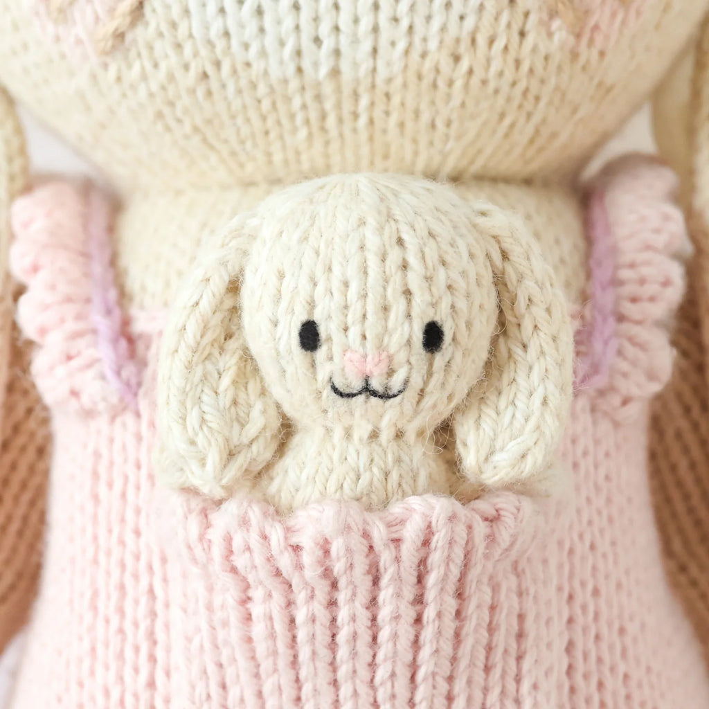 Hand Knit Bunny Doll in Peony Pink, 13-Inch Cotton Toy with Soft Details and a 10-Meal Giving Wristband