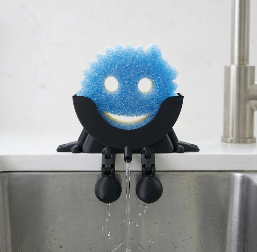 Kitchen Sponge Holder with Articulated Dangling Legs and a Front Drainage Spout for Sink-Side Storage