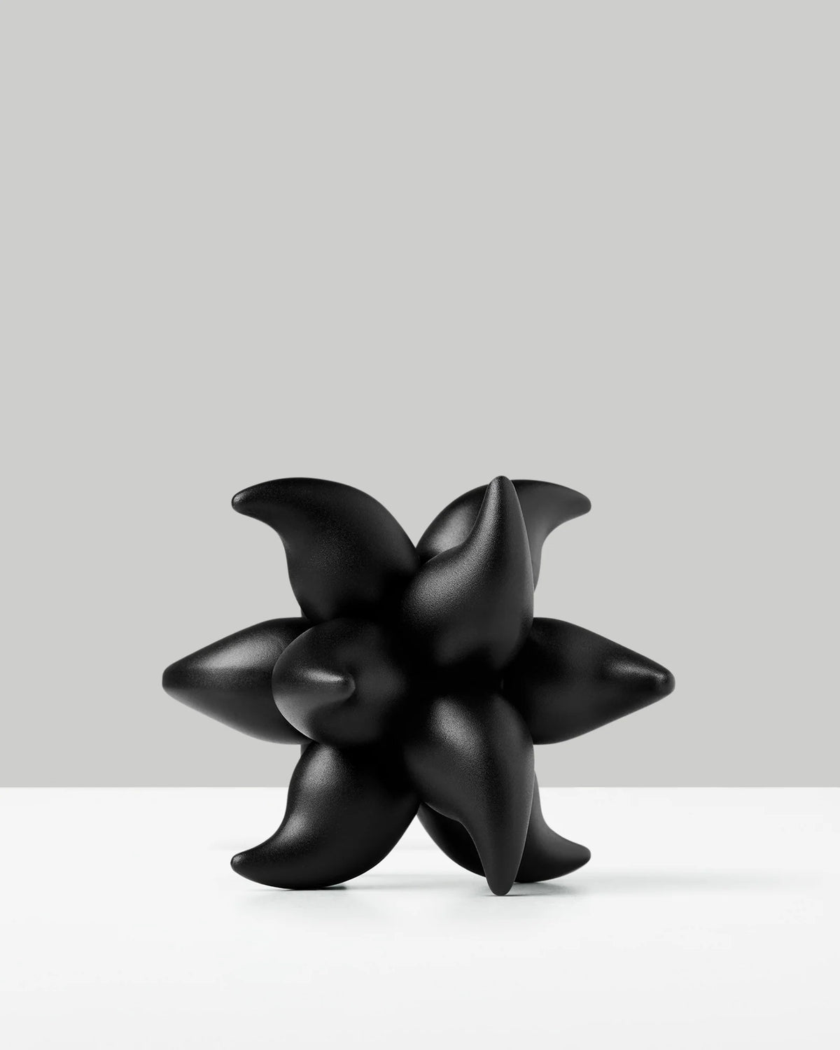 Mechanical Burr Puzzle in Black Anodized Aluminum with Six Identical Interlocking Pieces and Shifting Symmetry
