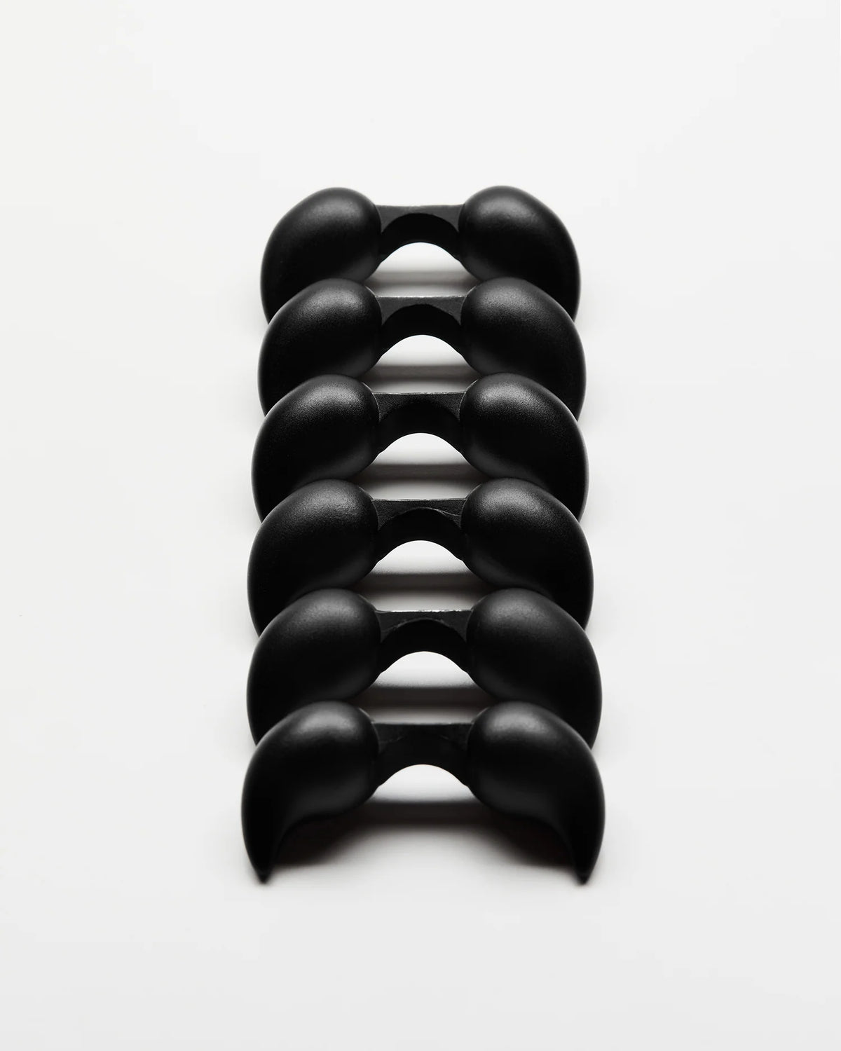 Mechanical Burr Puzzle in Black Anodized Aluminum with Six Identical Interlocking Pieces and Shifting Symmetry