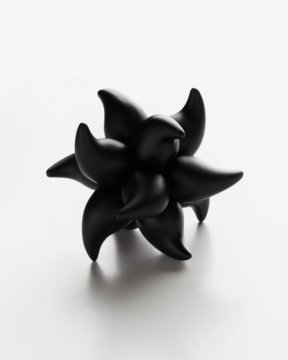 Mechanical Burr Puzzle in Black Anodized Aluminum with Six Identical Interlocking Pieces and Shifting Symmetry