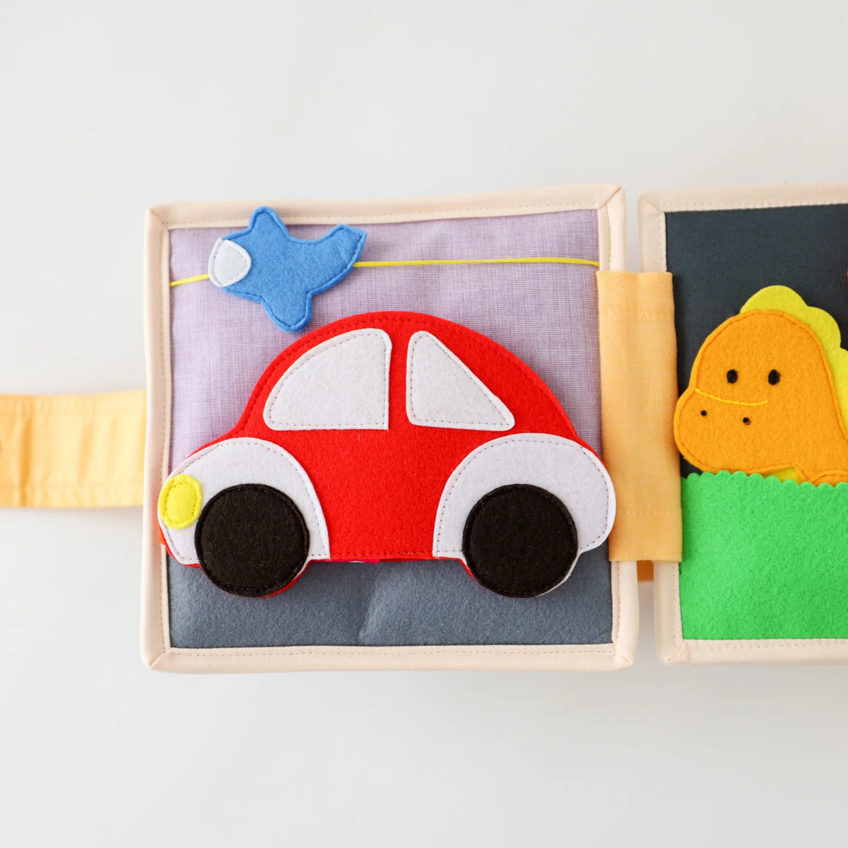 Mini Busy Book for Practical Skills and Imaginative Play with Three Dinosaur Finger Puppets