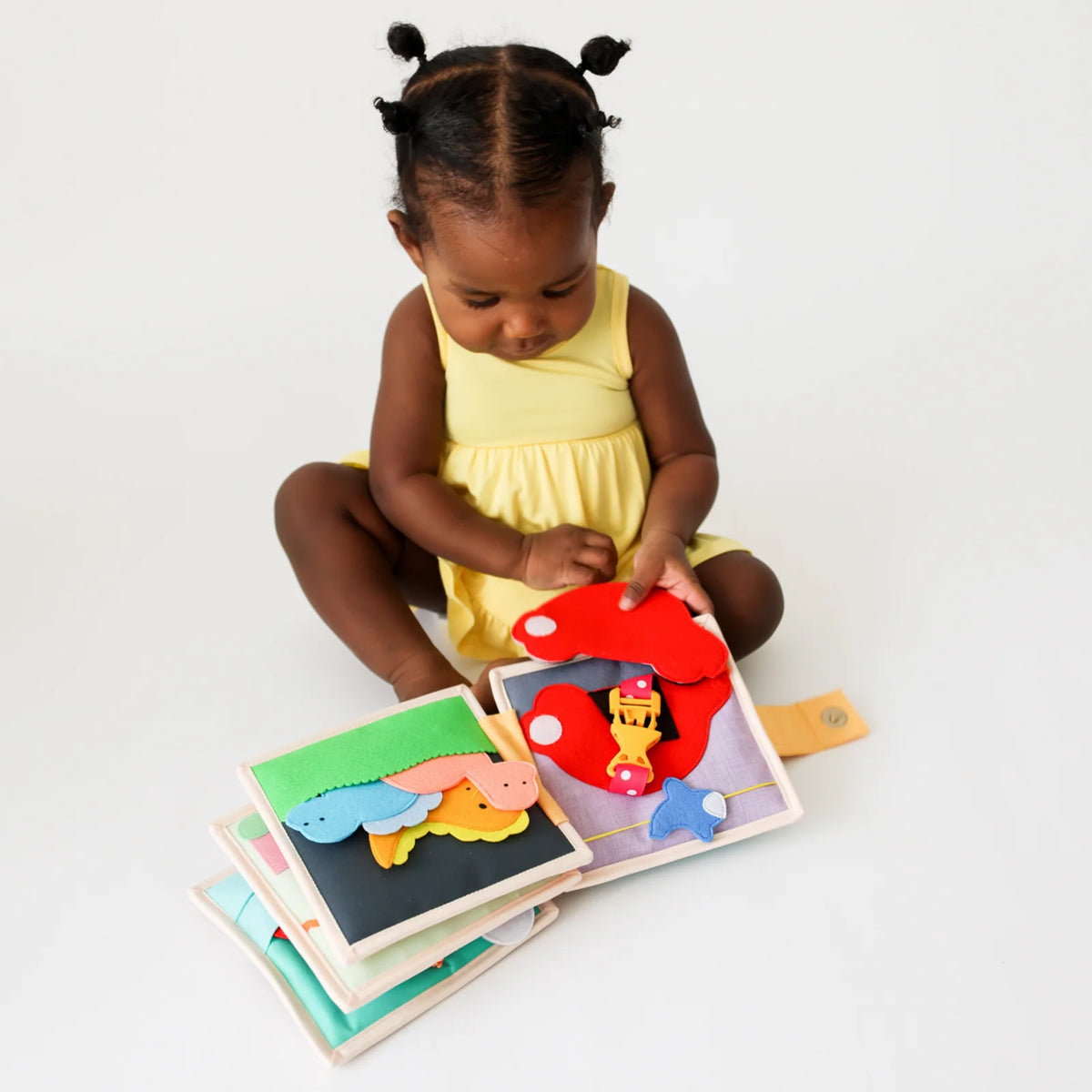Mini Busy Book for Practical Skills and Imaginative Play with Three Dinosaur Finger Puppets