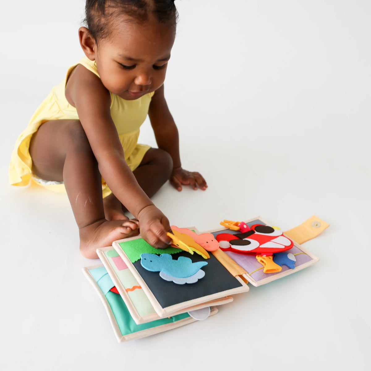 Mini Busy Book for Practical Skills and Imaginative Play with Three Dinosaur Finger Puppets