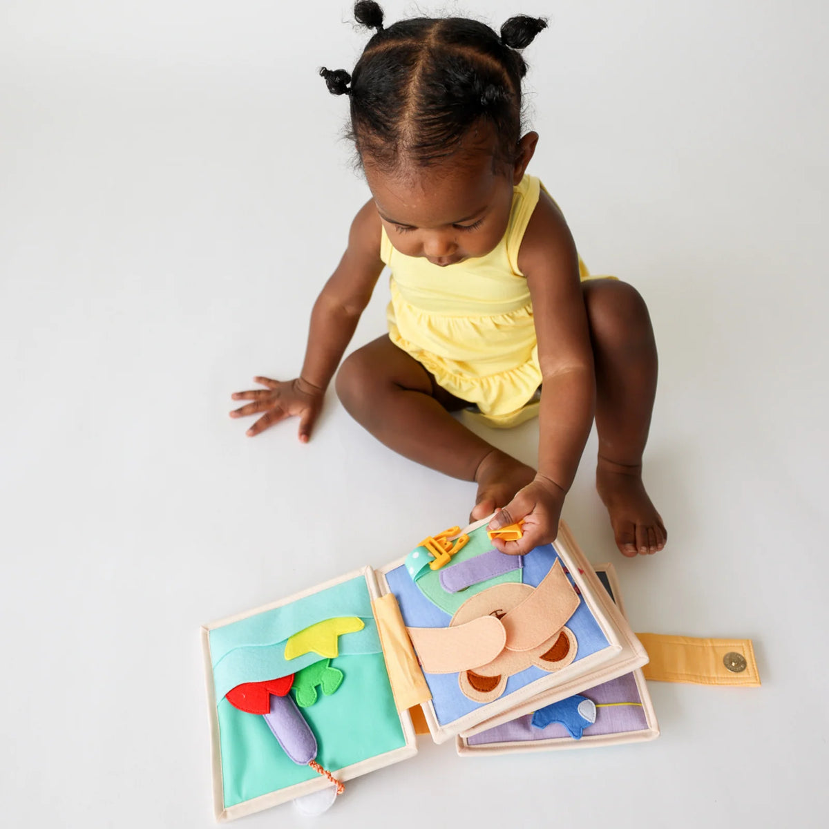 Mini Busy Book for Practical Skills and Imaginative Play with Three Dinosaur Finger Puppets